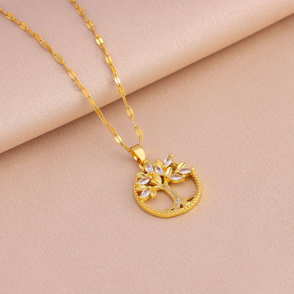 Colgante retro informal de árbol de la vida con incrustaciones de cobre y circonitas bañado en oro